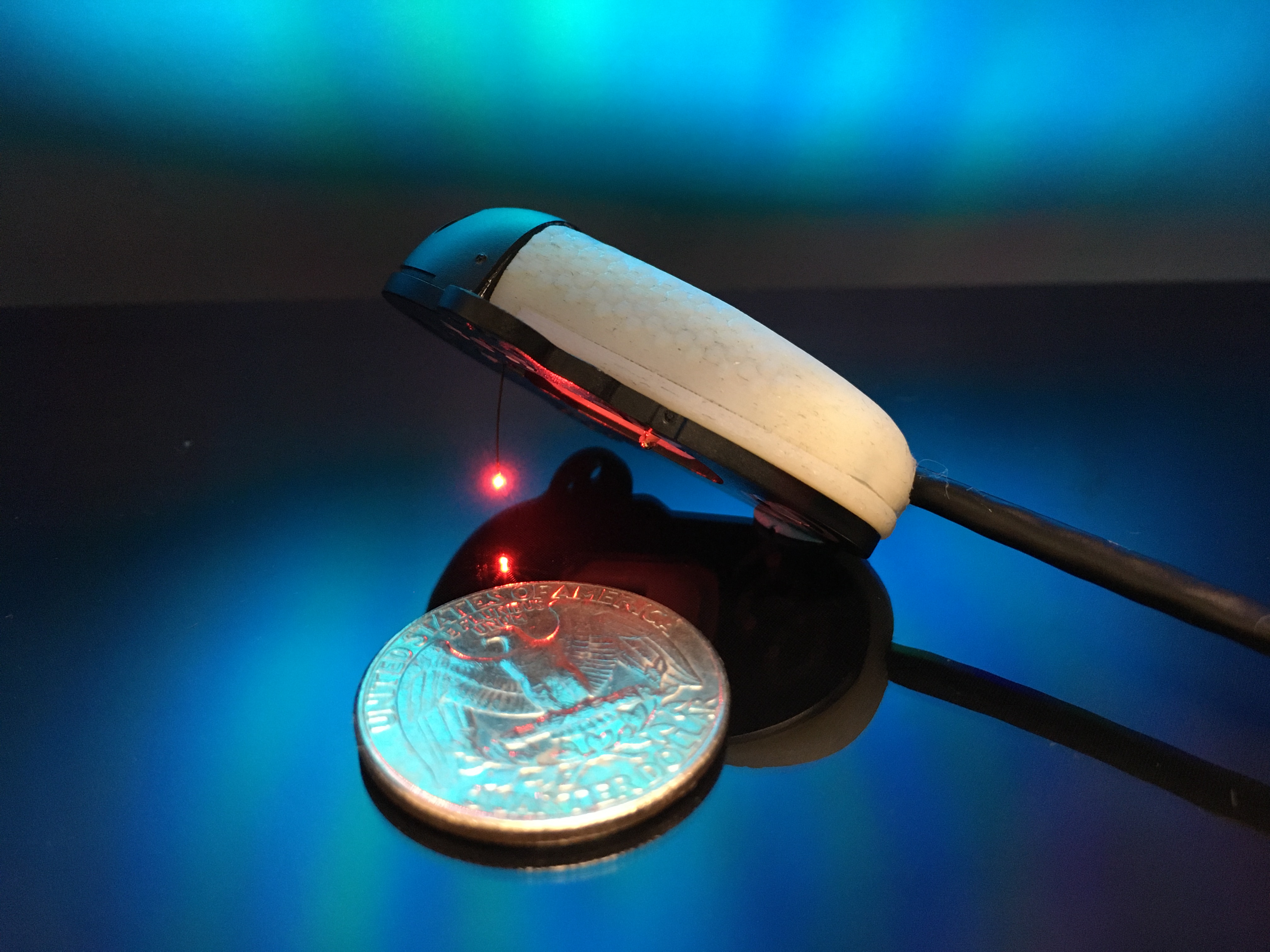 Device next to a quarter to distinguish scale