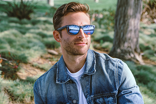 male wearing enchroma glasses