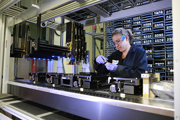 Neurocrine executive director of chemistry research, Nicole Harriott retrieves reagents from automated inventory system