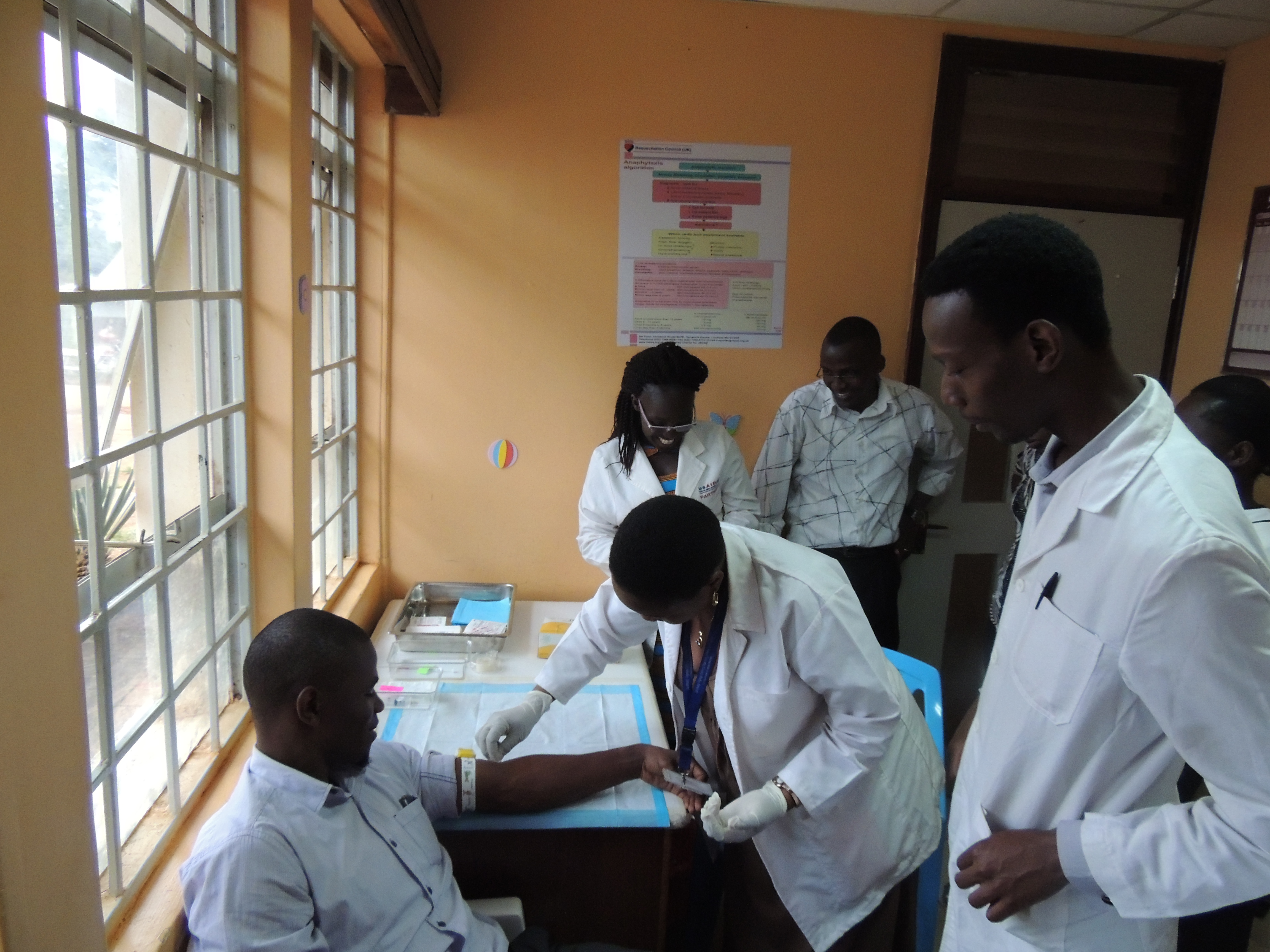 Image of a group of medical professionals and a patient